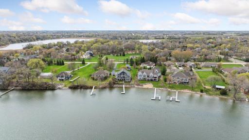 Approximately 97 feet of lakeshore! Just across the road...Sugarbush Park, walking / bike trails. So many options to entertain!
