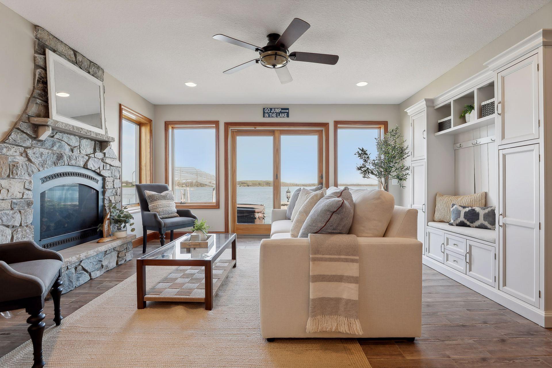 Walkout lower level family room that leads to paver patio and hot tub! Serene views and stunning stone, gas fireplace.
