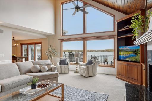 Neutral colors throughout. Towering living room ceilings. Floor to ceiling windows bring the sunshine and serene lake views inside. The views through those large windows will likely never disappoint!