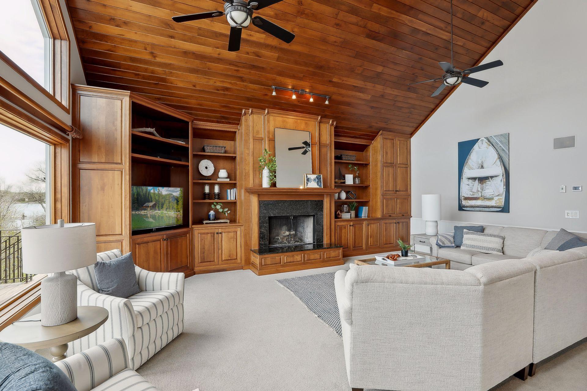 You will be in awe of the custom designed cabinetry, shelving and elegant wood ceiling.
