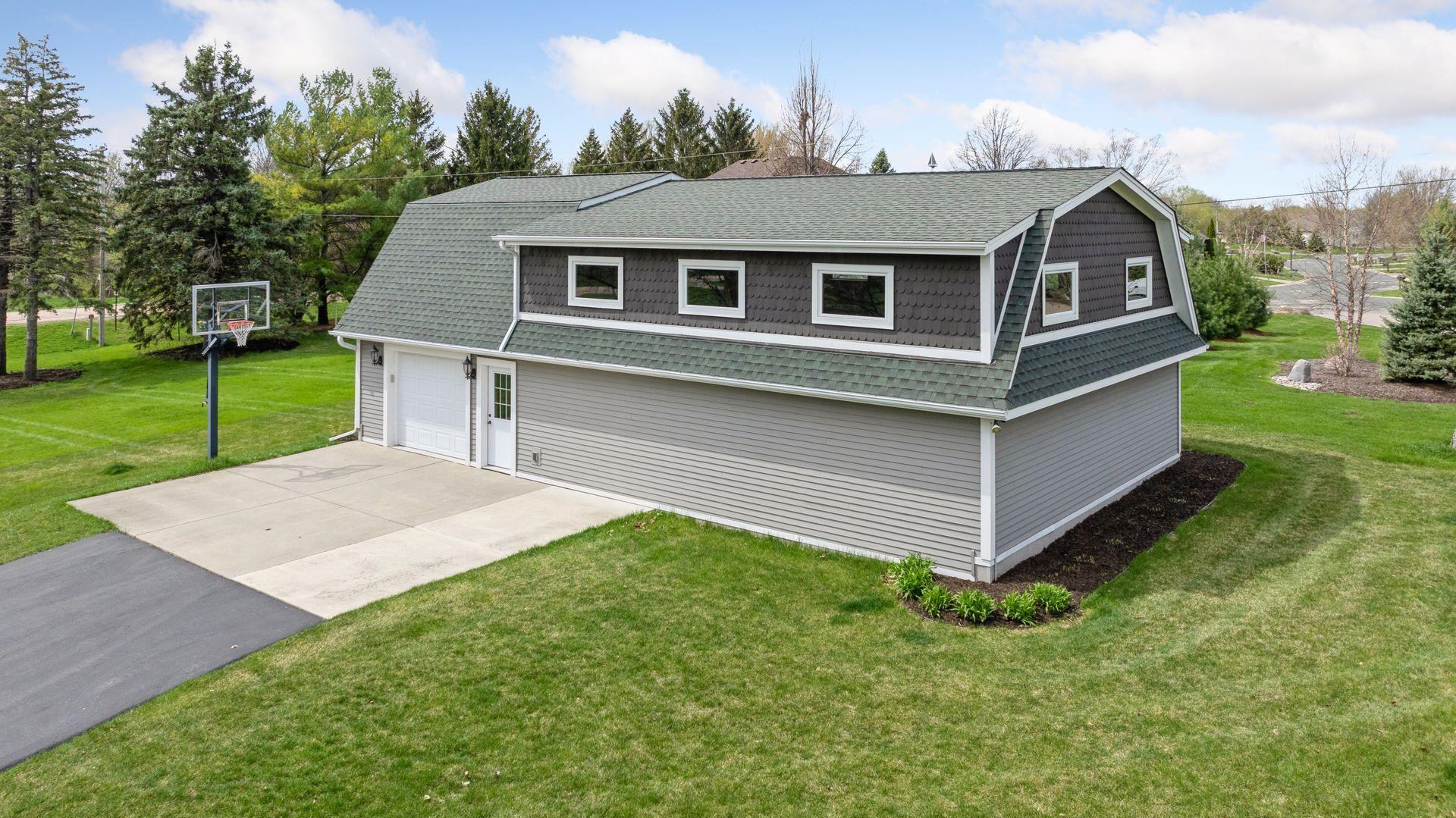 A building full of fun and extra, extra parking! 3 car garage stall and additional parking spaces for your lake guests. Many options for this great building. Lakeshore and this outbuilding, hard to find setup!!