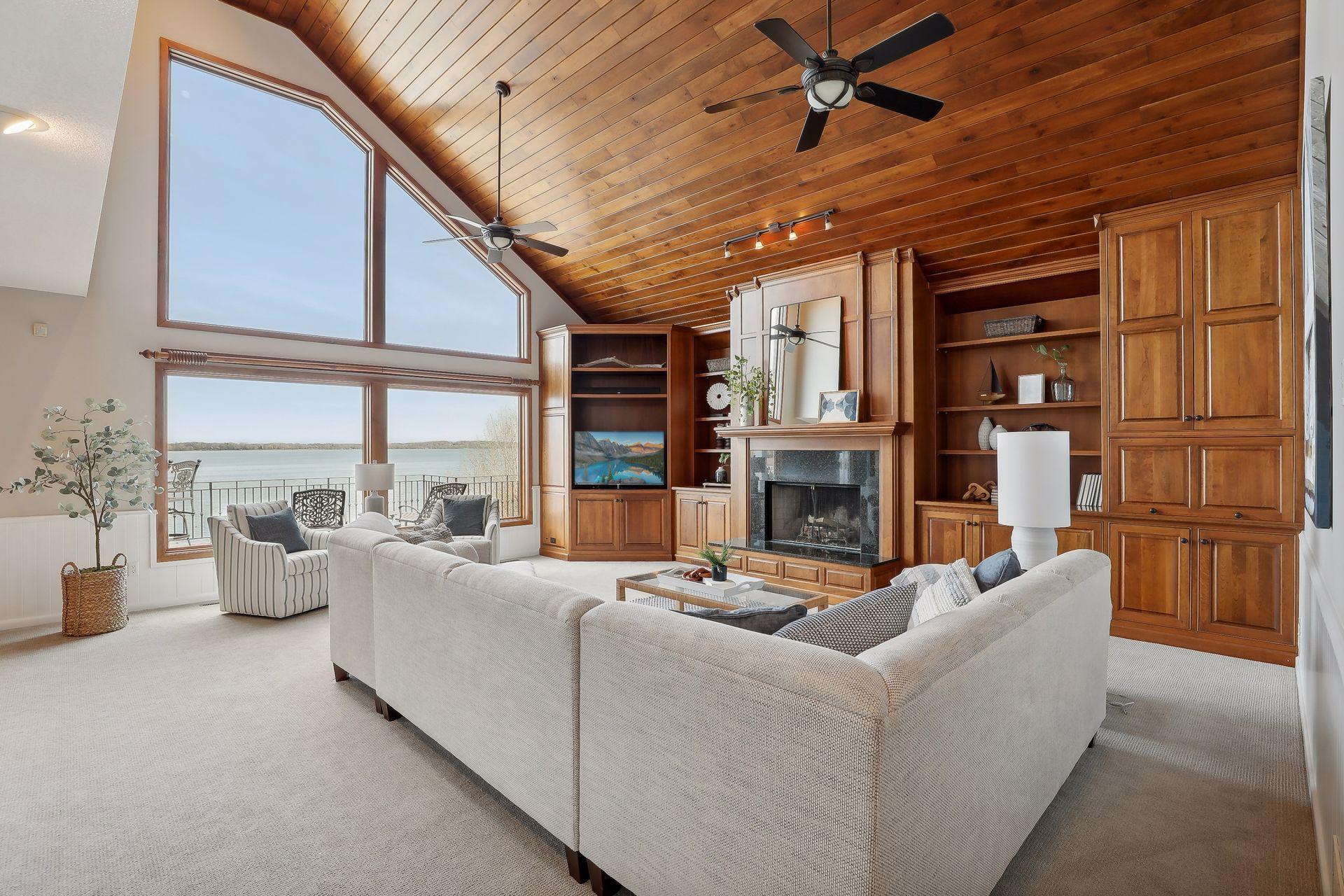 Towering vaulted ceiling w/ floor to ceiling windows.
