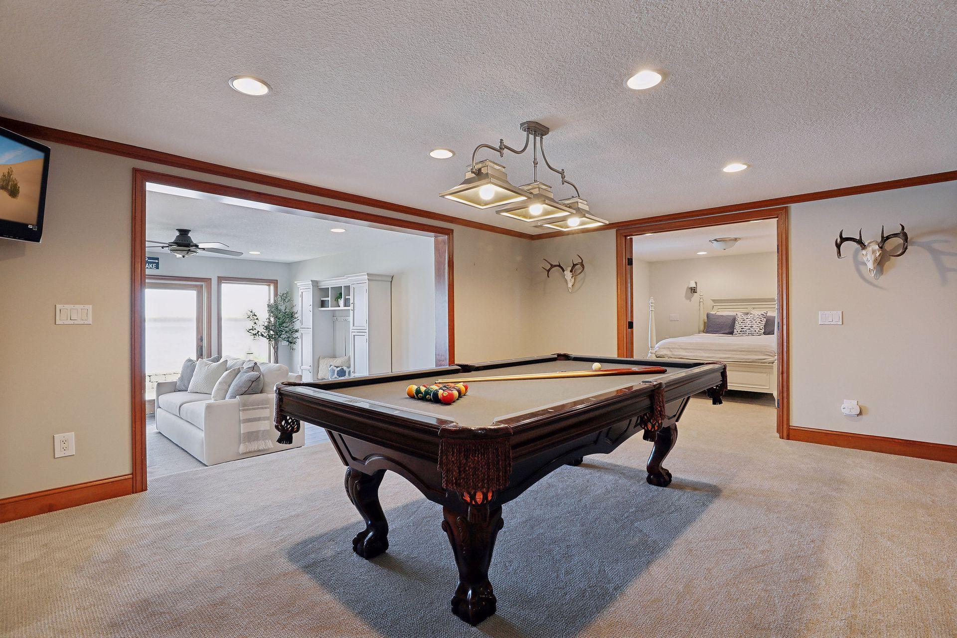 Amusement room is setup to entertain w/ a billiards area and elegant bar. You'll have so much fun entertaining your guests with lots of options at the lake!
