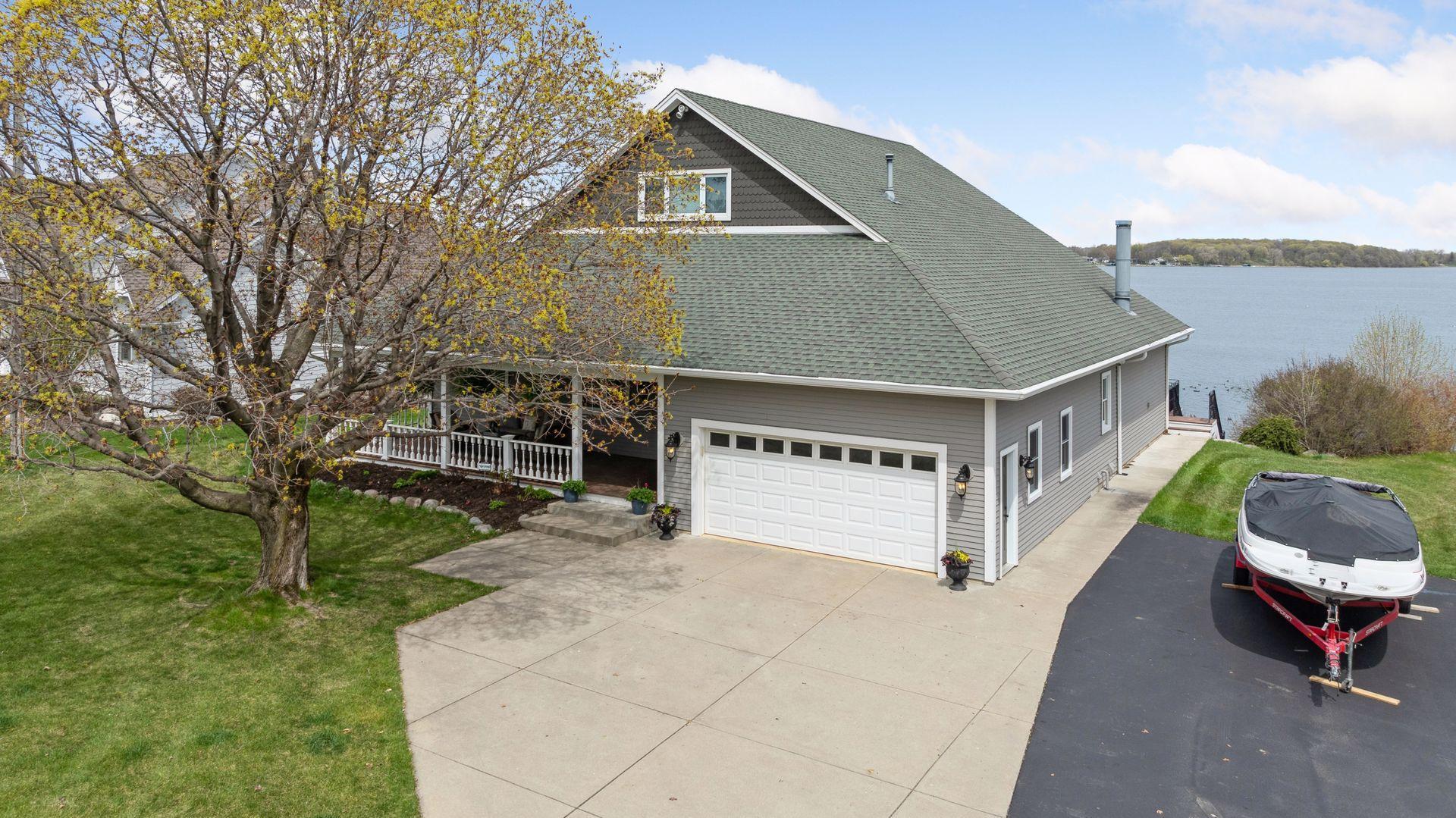 Standout home w/ approximately 5,225 FSF. Charming front porch and beautiful mature tree welcomes you and your guests. Two extra large parking spots next to the house offers great parking for guests as well.