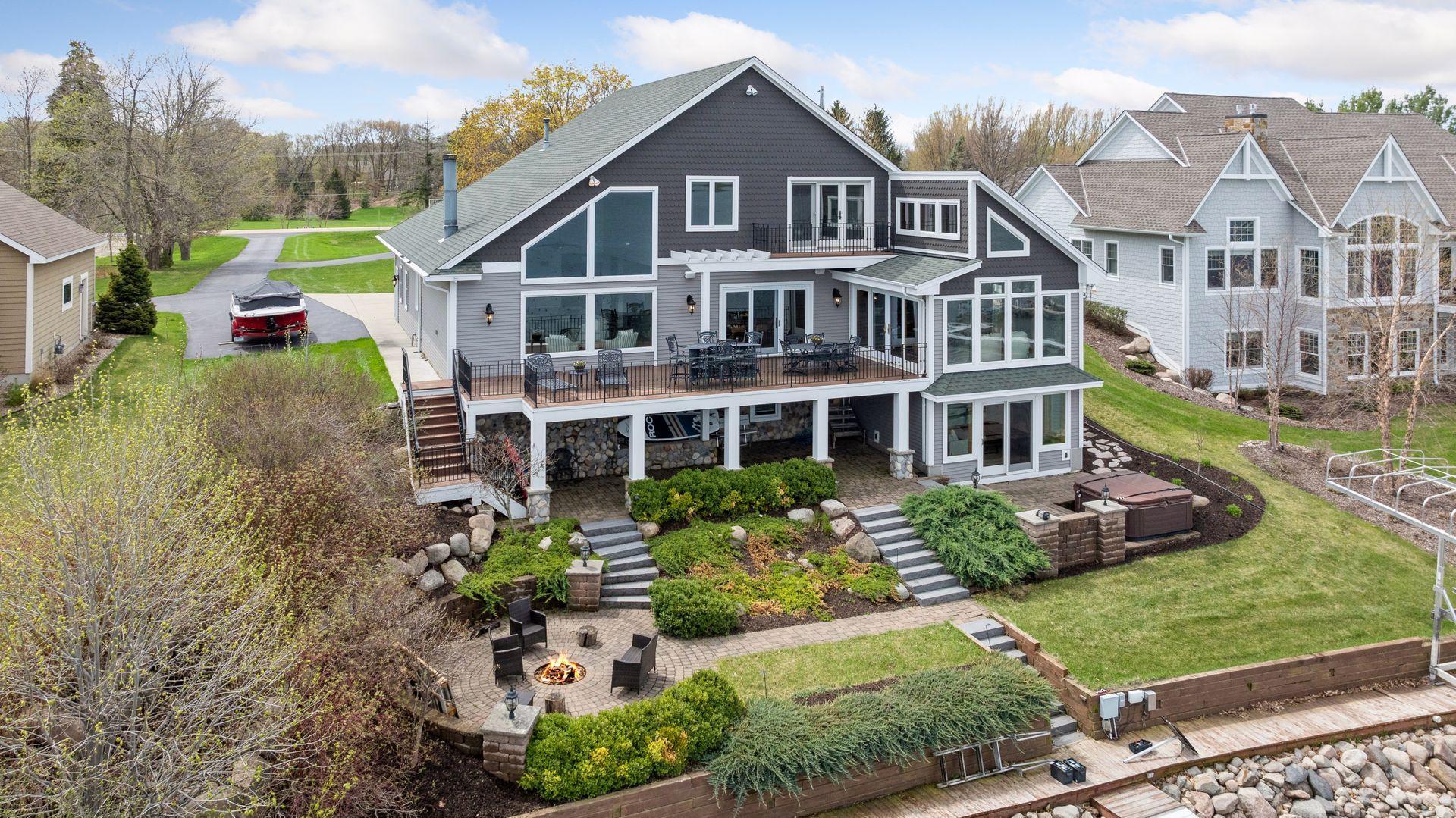 Unique, lake property built for entertaining with oversized deck, paver stone patios and so much more! Don't miss this dreamy lake retreat on 1 acre in highly sought after Lake Waconia! Beautifully landscaped yard with panoramic views!