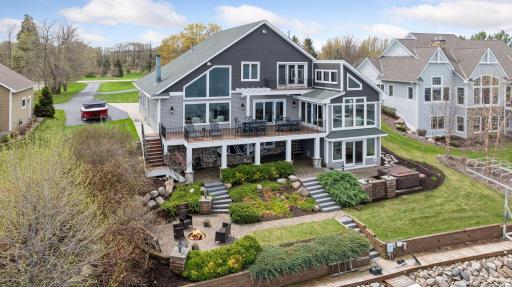 Unique, lake property built for entertaining with oversized deck, paver stone patios and so much more! Don't miss this dreamy lake retreat on 1 acre in highly sought after Lake Waconia! Beautifully landscaped yard with panoramic views!