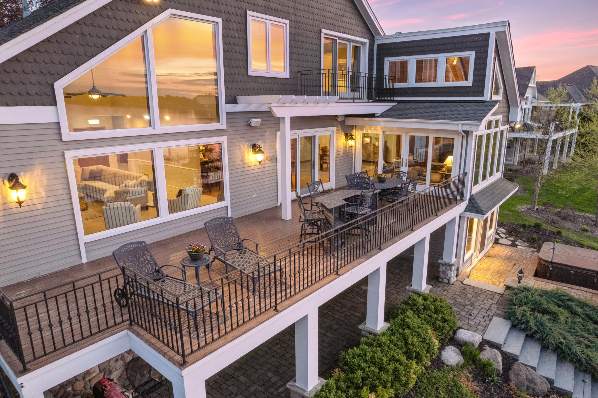 Check OUT all those windows and double patio doors! Breathtaking lake views on the entire back side of this Lake Waconia GEM!