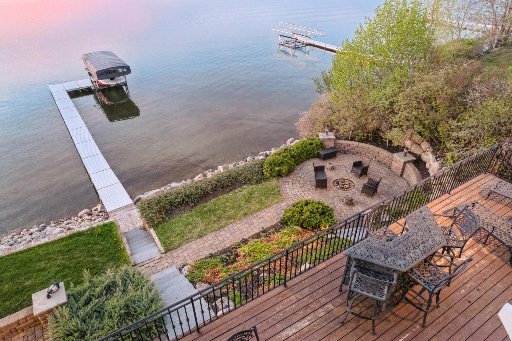 Private firepit area, paver patio and walkway. Beautifully landscaped.