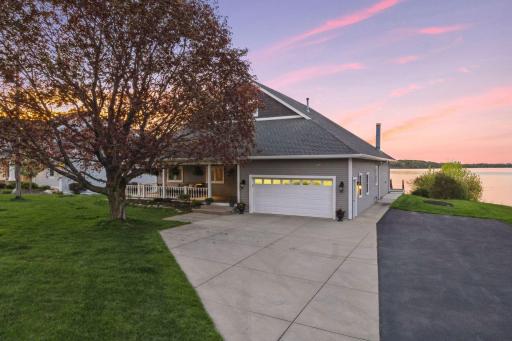 Standout home w/ approximately 5,225 FSF. Charming front porch and beautiful mature tree welcomes you and your guests.