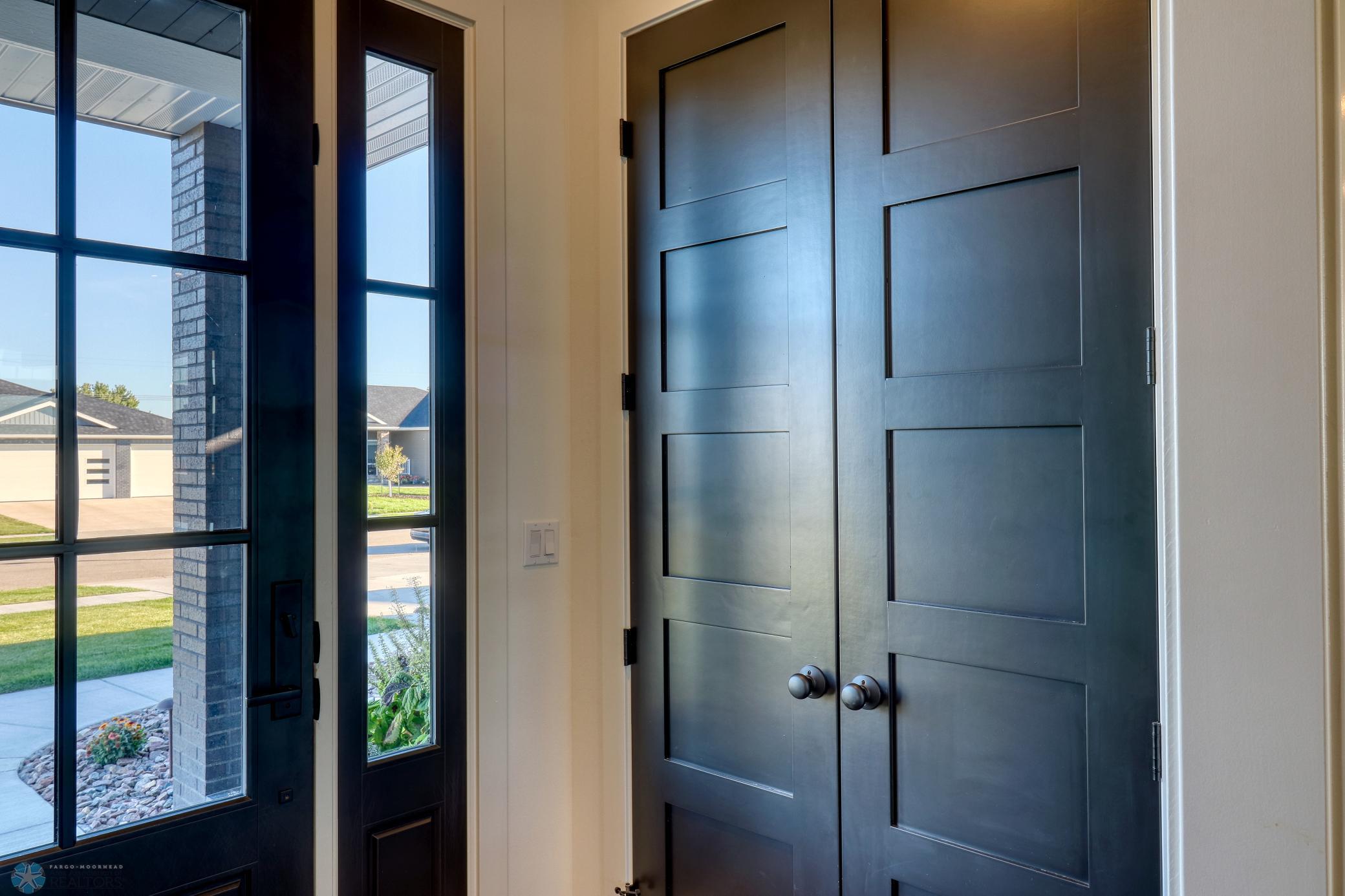 Entry closet w/high end panel doors