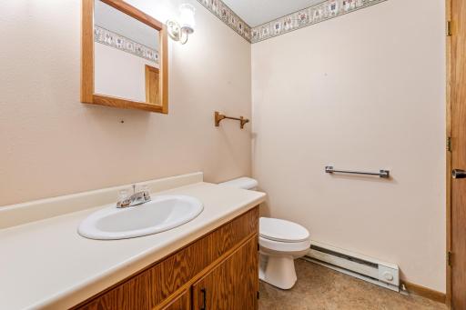 Additional 1/2 bath with vanity for all your storage and organization needs.