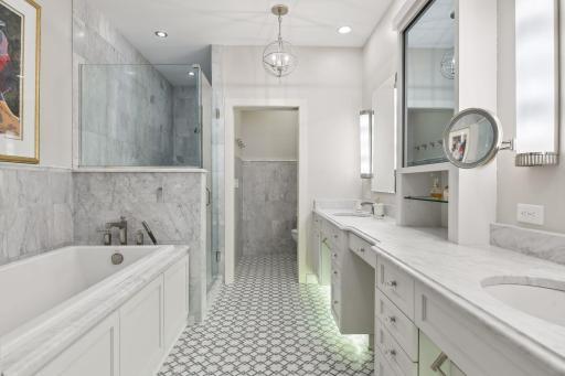 Dual vanity areas, large soaker tub, and separate walk-in shower