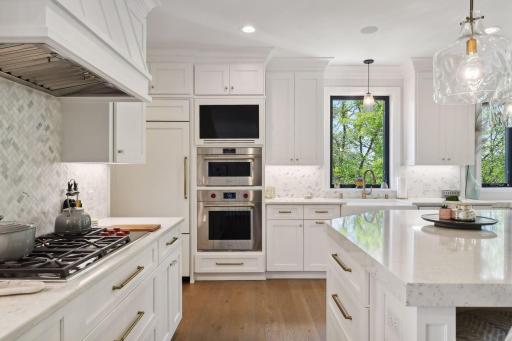 The Kitchen enjoys a professional appliance package from Wolf and Subzero with a 36" gas cooktop, steam oven, microwave drawer and a Cove dishwasher.
