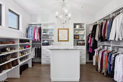 The Dressing Room has been outfitted with a custom organizer system, a built-in dresser with Cambria countertop and a beautiful light fixture.