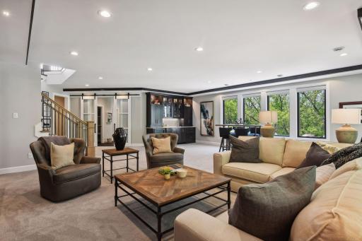 Featuring 9.5-foot ceiling and an open layout, the lower level is bright and inviting.