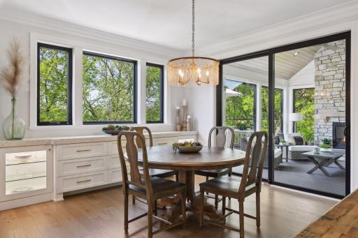 Whether you are having a quiet evening meal or hosting Sunday brunch, this Dining Room was designed for comfort with a wall-to-wall built-in buffet topped with quartz and featuring soft-close drawers and cabinetry.