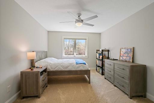 With its neutral paint, soothing ceiling fan, and abundant natural light, this inviting 4th bedroom located upstairs offers the perfect retreat for relaxation and restful nights.
