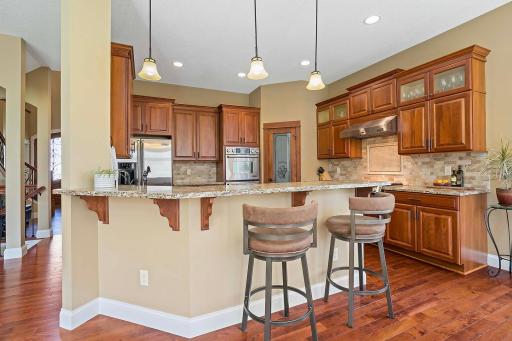 With extra tall cabinets that reach for the ceiling, this kitchen offers ample storage space for all your culinary essentials. Enjoy the extra seating option to eat breakfast or to be part of the action while meals are being prepared.