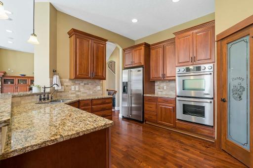 The kitchen, with its impeccable design and luxurious amenities, is sure to inspire your inner chef and elevate your cooking experience to new heights. The kitchen boasts exquisite granite countertops that exude elegance and sophistication.