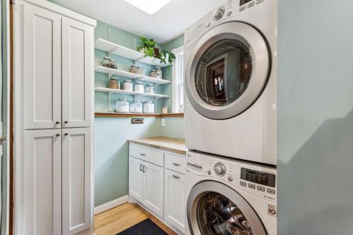 Convenient main-floor laundry and extra storage between the kitchen and the dining room.