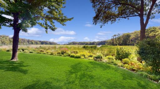 Welcome to this gracious Condominium home set in a quiet neighborhood offering spectacular views of Gleason Lake!