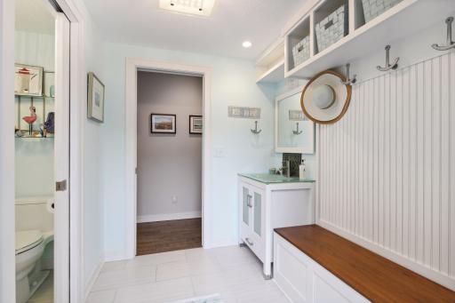 Lower level half-bath leads straight out to the patio and pool area.