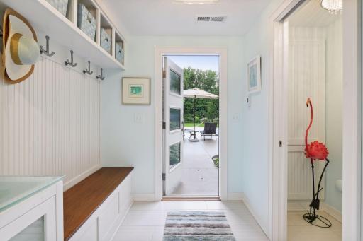 Lower level half-bath leads straight out to the patio and pool area.