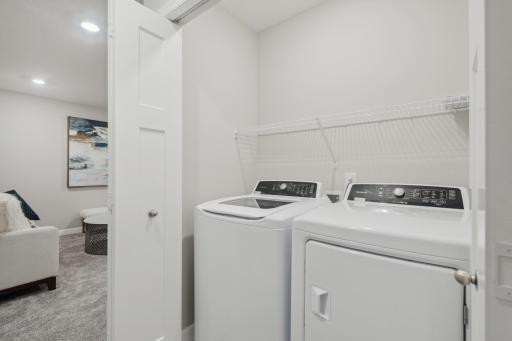 (Photo of a decorated model, actual homes finishes will vary) Upper level laundry has never made chores easier!
