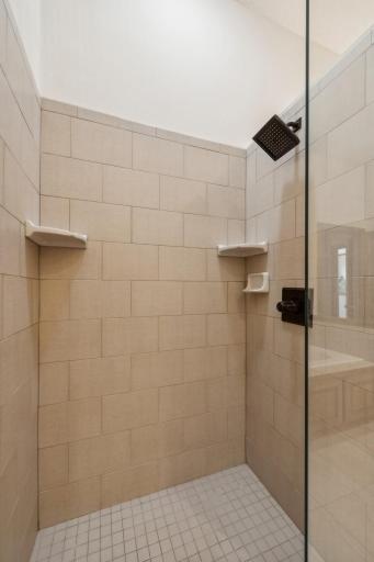 Ceramic tile shower with frameless glass shower door!