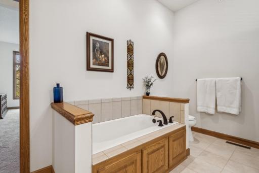Pearl 18" deep soaker tub with ceramic tub surround and modern oil-rubbed-bronze fixtures! The toilet has been upgraded too, and is extra tall with an elongated bowl.