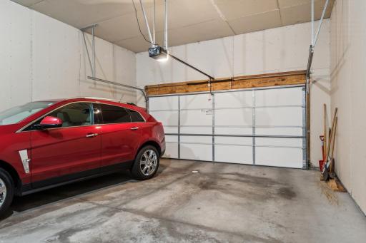Wowza! Nice deep (26' deep x 20' wide) garage with keypad entry, floro drain, and 12' tall ceilings! Bring on the pick-up trucks!!