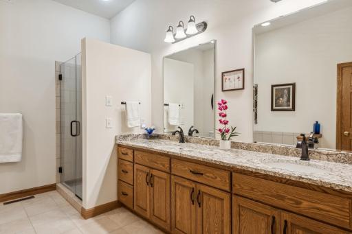 This private primary bath is amazingly oversized and features heated ceramic tile flooring!