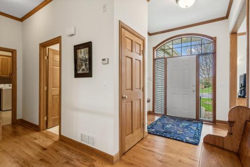 Steel core front door with two sidelights, wood blinds and a large transom window! Notice the nice coat closet here too!