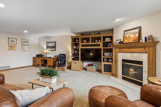 This family/rec room also features solid oak millwork and doors and also some built-in oak media cabinets.