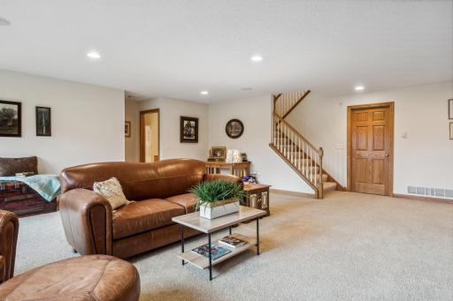 This room also features built-in ceiling speakers, professionally painted, neutral walls, and extra plush, neutral carpeting! The recessed lights add to an already bright space.