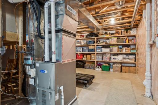 2015 installed Carrier Performance HE furnace, PVC drain plumbing, copper supply plumbing and lots of built-in storage shelving! Don't miss the garage floor drain cleanout.