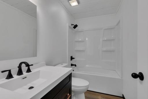 Lower level full bath is convenient to each bedroom and other living spaces. Features a sleek vanity with plenty of storage.