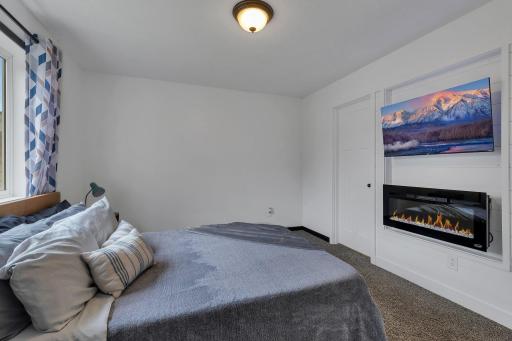 The primary bedroom oasis is spacious and delivers tranquility with your own private fireplace.