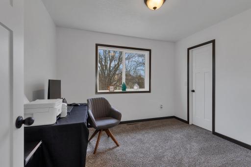 Second upper level bedroom features plush carpet, neutral colors, abundant natural light and a walk-in closet.