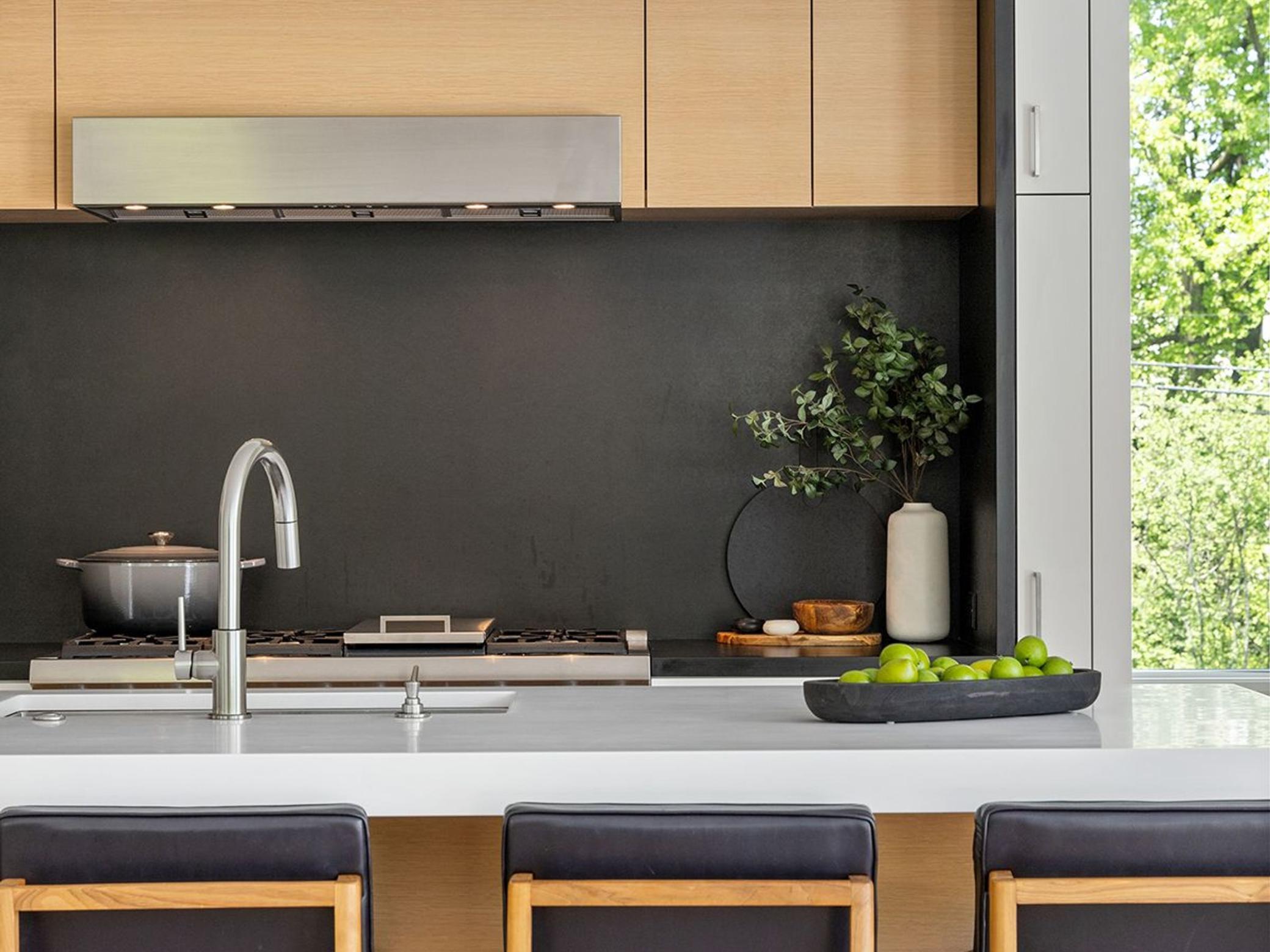 Additional storage is built-in to nearly every inch of this kitchen, while maintaining the clean, elegant lines that define the home.