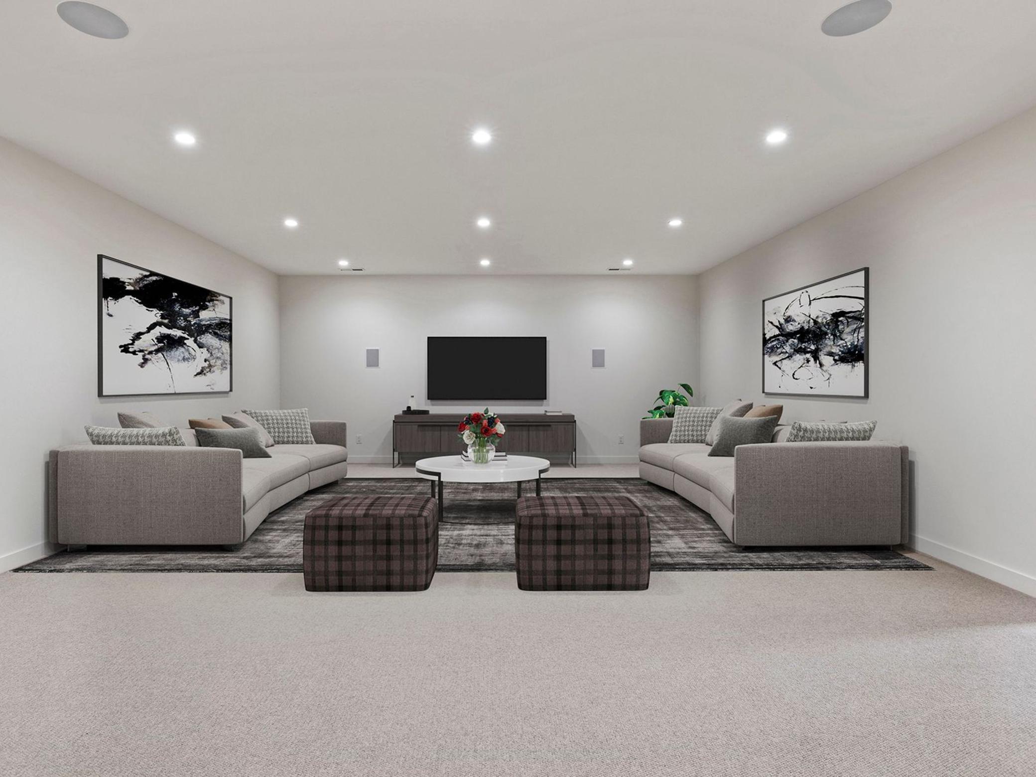 Incredible, spacious lower-level family room - perfect for movie nights. Virtually staged.