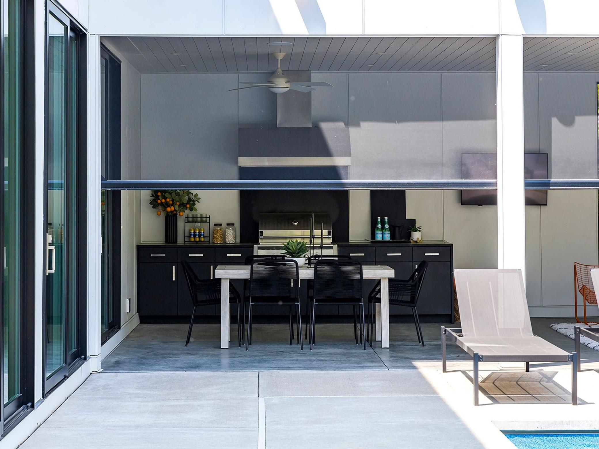 Custom mechanical screens make this the perfect space to dine al fresco on those summer evenings.