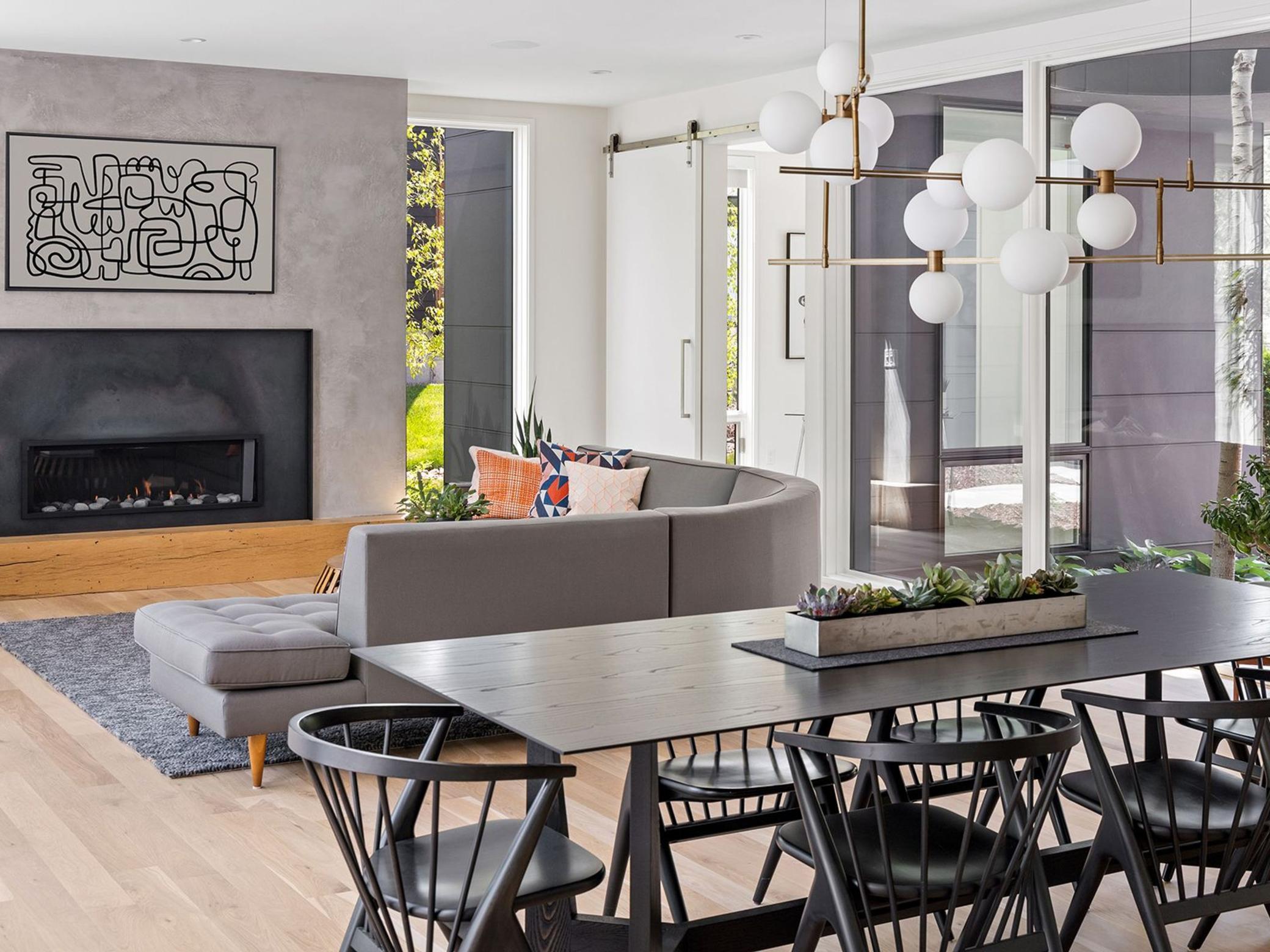 Floor-to-ceiling windows on all sides of the home flood the interior with natural light.