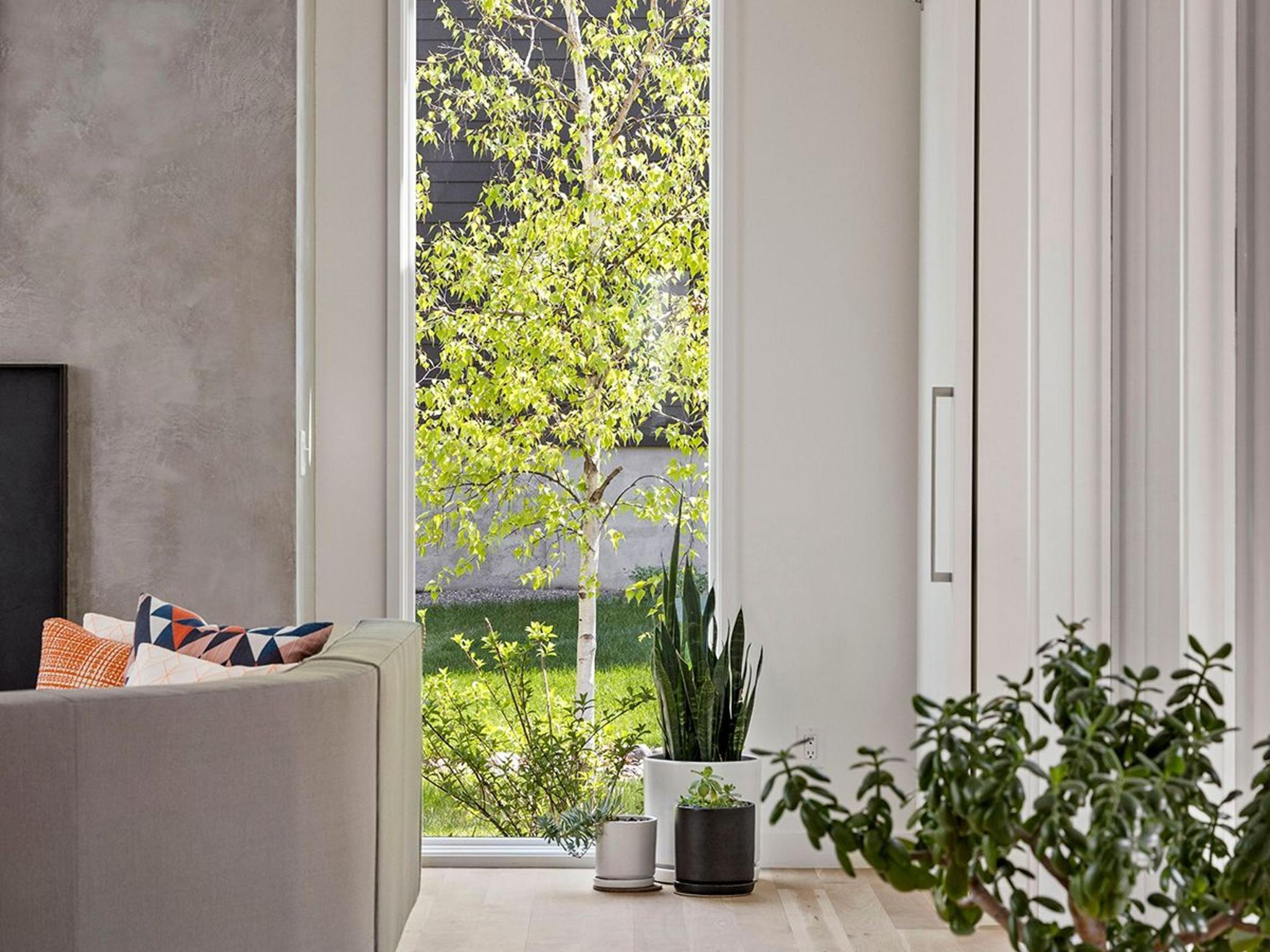 Floor-to-ceiling windows on all sides of the home flood the main level with natural light and views.
