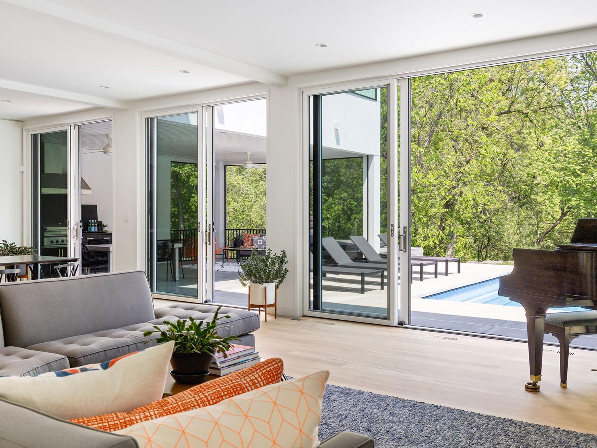 Four total sliding glass doors open to the stylish outdoor living area.