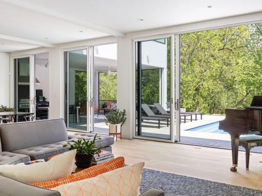 Four total sliding glass doors open to the stylish outdoor living area.