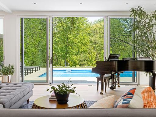 High ceilings, wide plank white oak flooring and expansive sliding glass doors create a light and airy sanctuary.