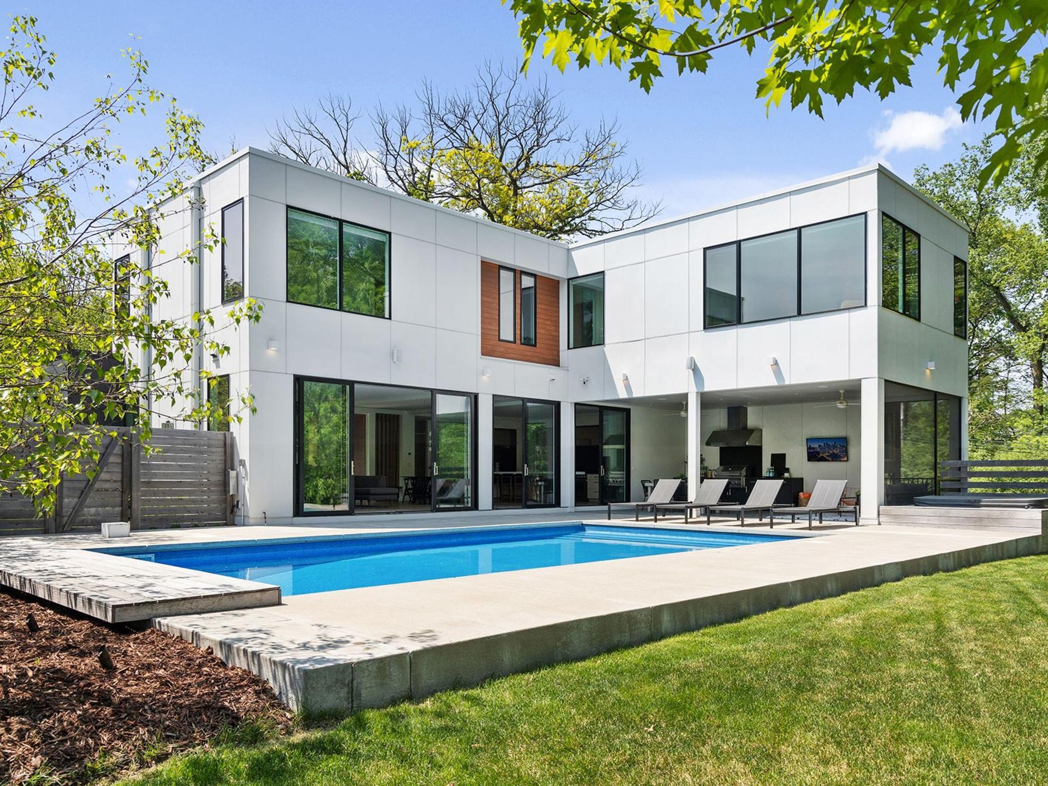 Welcome to the stylish outdoor living area, where a heated in-ground salt water pool, large spa, covered porch and outdoor kitchen offer optimal enjoyment and leisure.