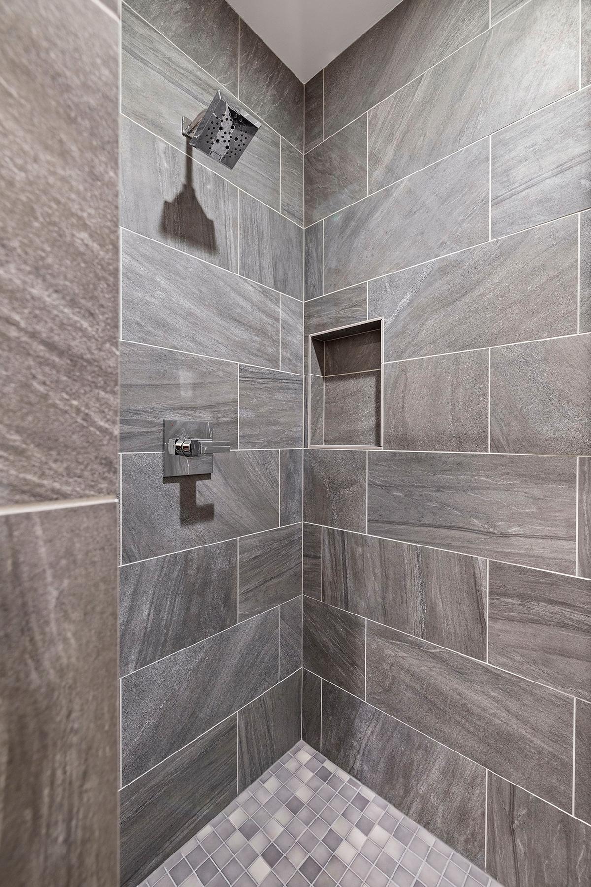 Custom shower tile in the lower level bath.