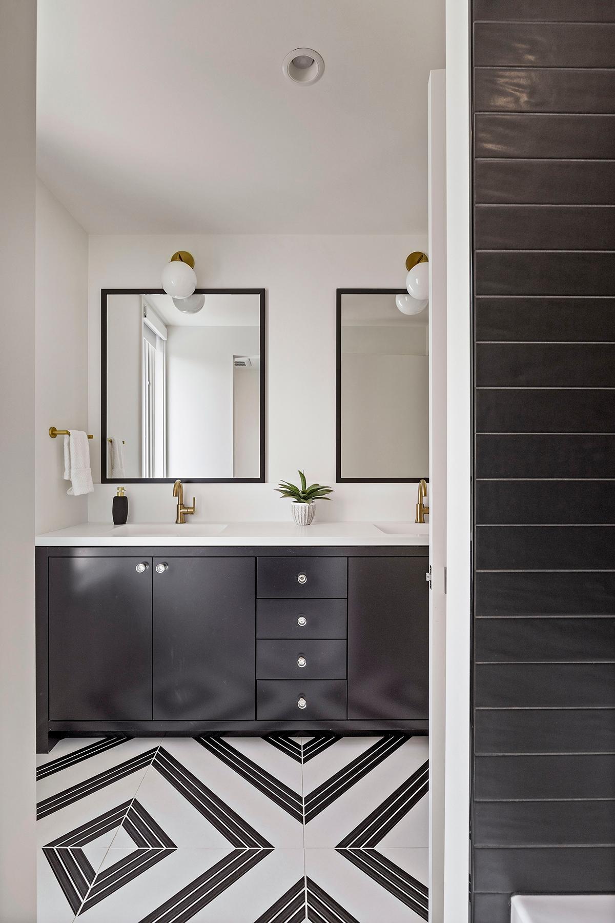 The upper-level full bath is adorned with stunning details, including exquisitely designed flooring.